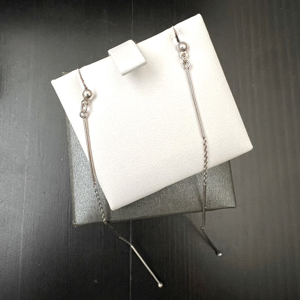 Dainty genuine silver dangle earrings.